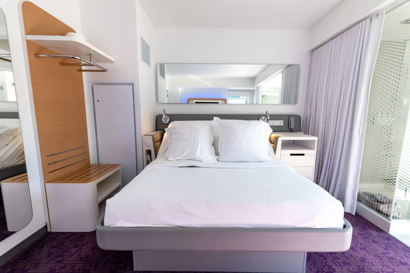 A comfortable bedroom with white bedding